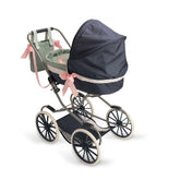 Luxurious navy doll stroller with a spacious carrycot, pink bows, and elegant wheels, designed for dolls 36-46 cm.