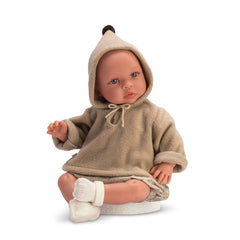 ASI Dolls - Leo in a beige hooded sweatshirt, floral skirt, and white booties, seated with expressive eyes.