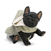 French Bulldog doll wearing a green raincoat, sitting with one paw raised.