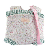 Floral-patterned baby doll carrier with pink strap and green ruffled trim, from ASI Dolls Cloe Collection.