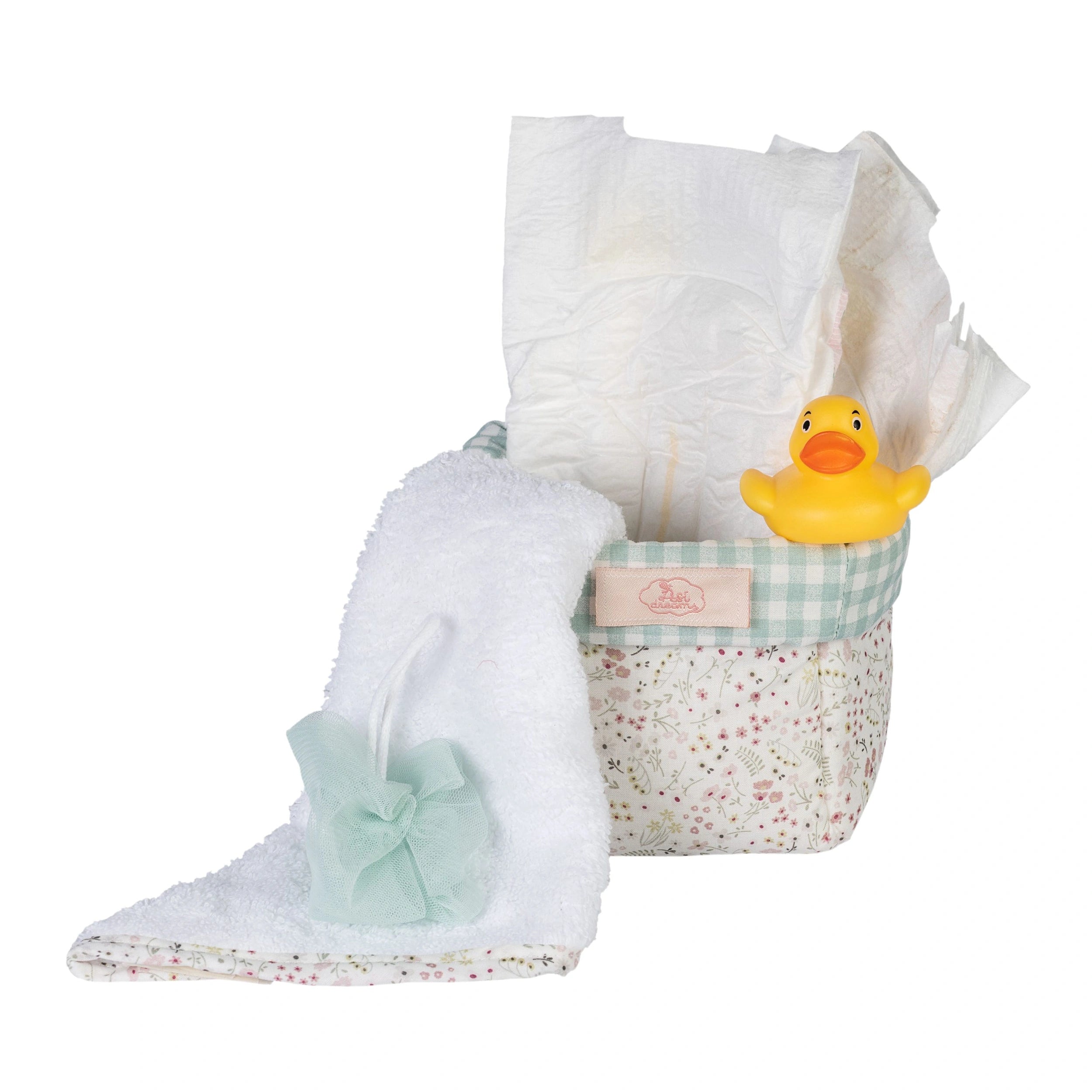 Quilted floral basket with diapers, a white towel, small tulle sponge, and yellow rubber duck for 36-50 cm dolls.