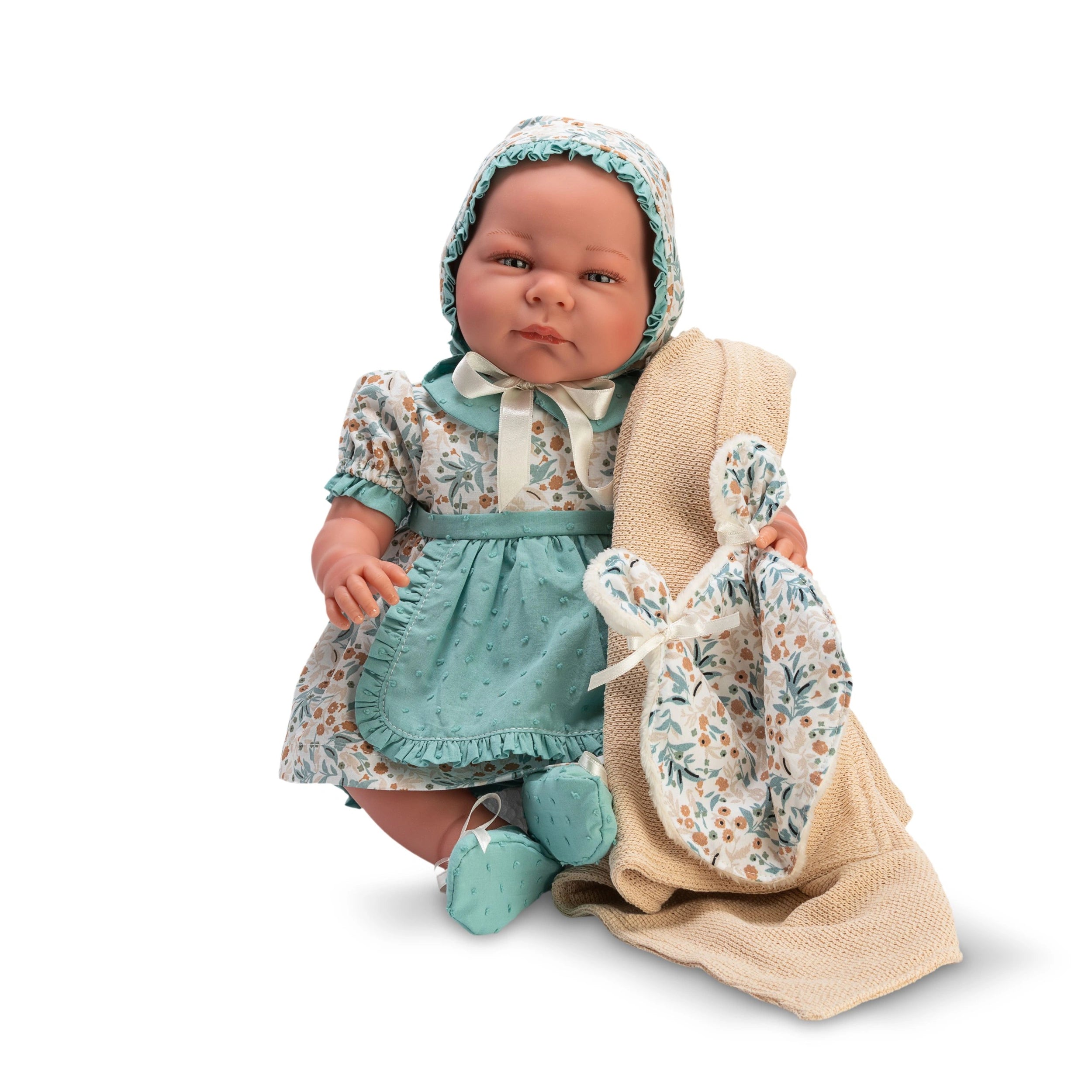 Reborn doll in a floral aqua dress with bonnet, holding a blanket, lifelike expression, part of ASI Dolls Aqua Collection.