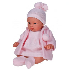 Koke, a 36 cm Asi Doll, in a soft pink duffle coat, dress, and hat with pom-poms, seated with lifelike blue eyes.