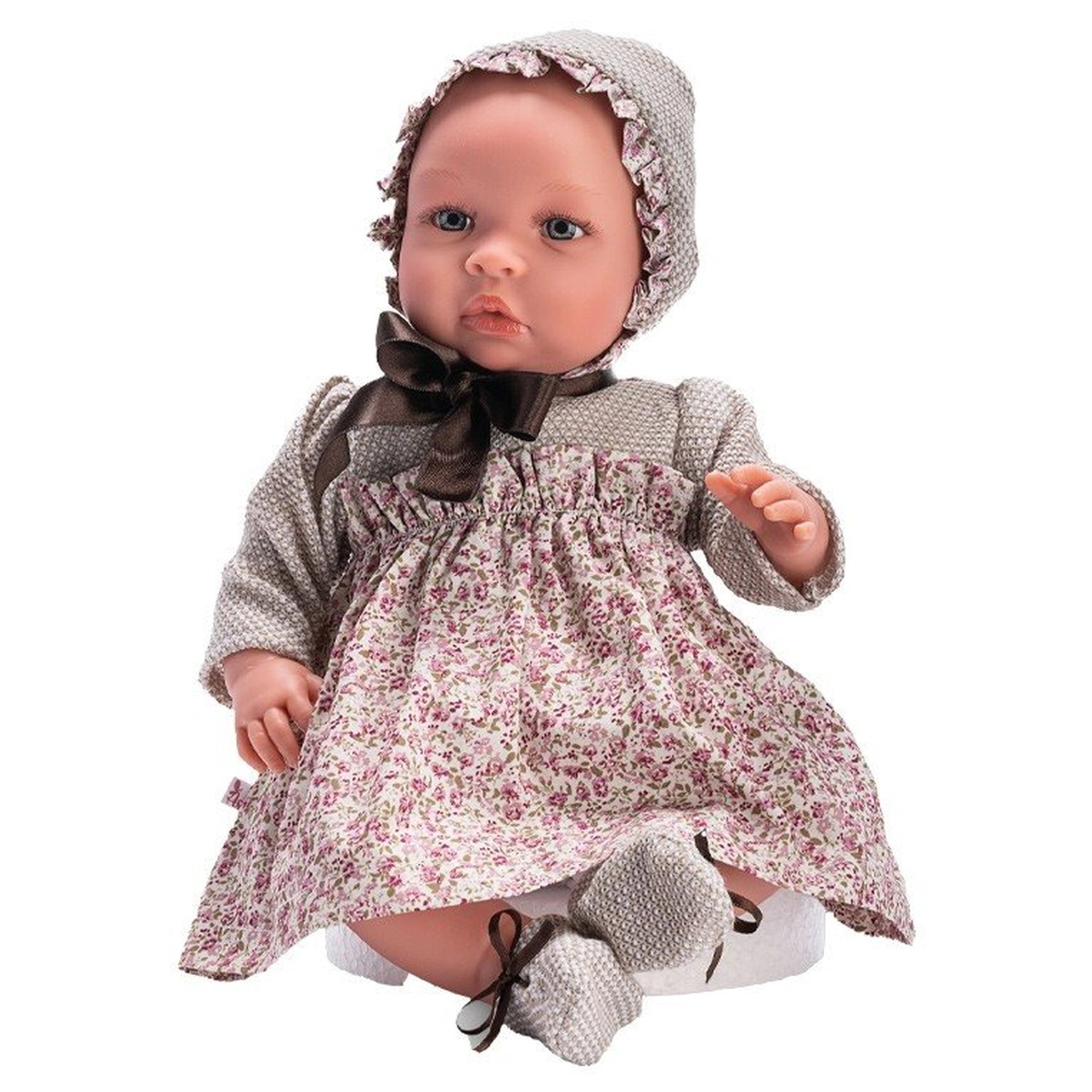 46 cm ASI Dolls Leo in a floral dress with a matching bonnet, featuring a soft, serene expression.