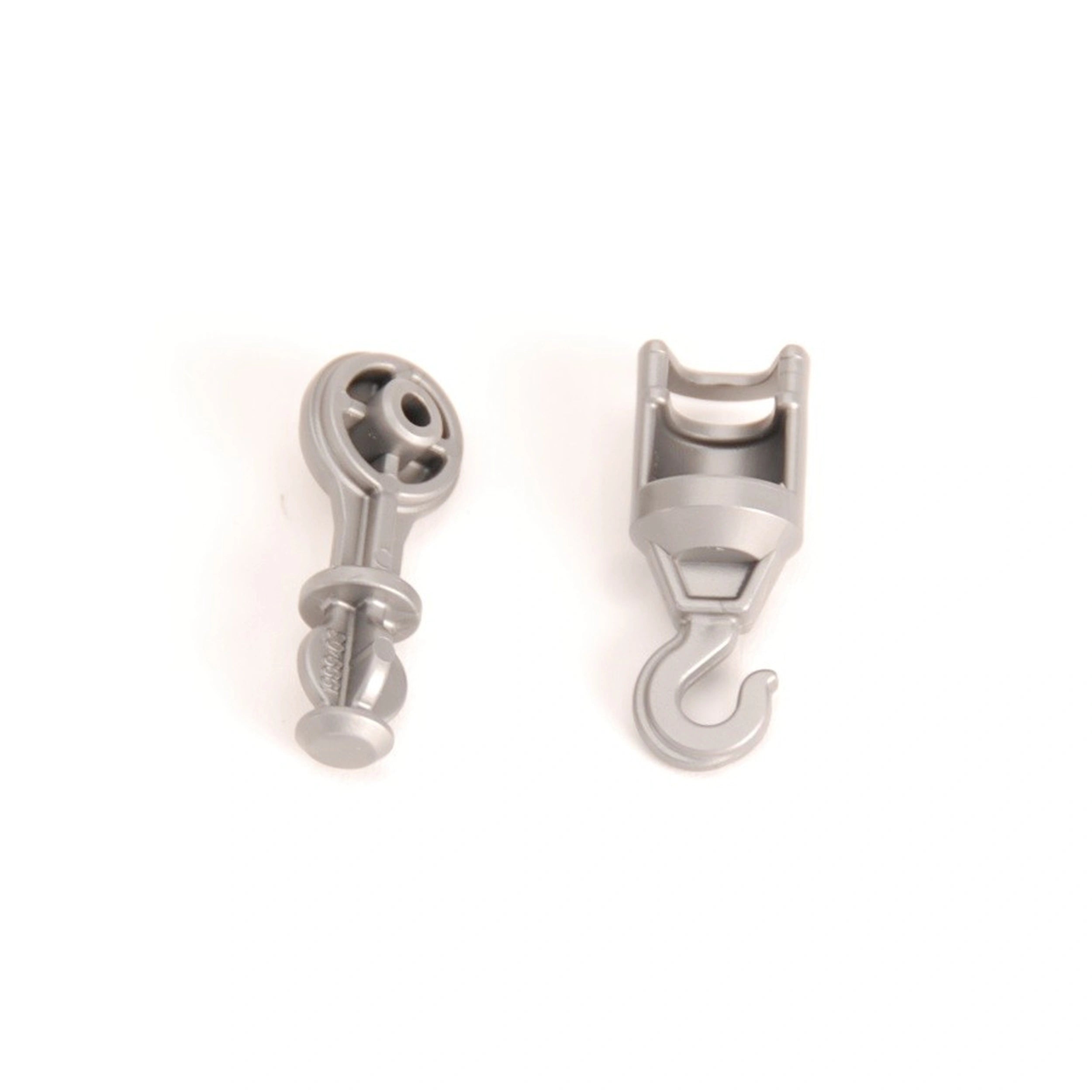 Gray plastic adapter and hook set for Bruder crane toys, shown against a white background.