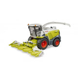 Green and silver Bruder Claas Jaguar 980 Field Chopper toy with red wheels and detailed corn header.