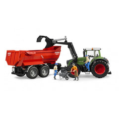 Bruder Fendt 936 Vario toy tractor with front loader and red Krampe trailer, two figures with wheelbarrow.