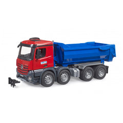 Red and blue Bruder MB Arocs halfpipe tipper truck with detailed cabin and multiple wheels on a white background.