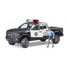 Black and white Bruder RAM 2500 police truck with red and blue lights, includes police officer figure.