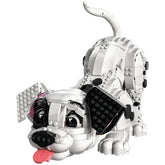 Black and white LEGO Dalmatian puppy with a playful expression, pink tongue sticking out, floppy ears, and a curved tail.