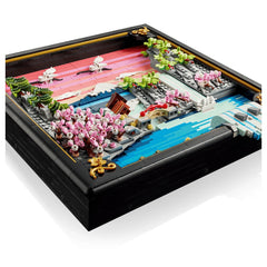 LEGO Art Japanese Cherry Blossom Landscape set features colorful pieces creating a vibrant scene with water, a bridge, and fi