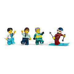 Four LEGO minifigures stand in a row: a pilot in a white shirt and blue tie, a doctor with glasses, a paramedic in green scrubs, and a skier in red gear, gliding on a ski.