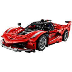 LEGO Ferrari FXX K model car kit, featuring a striking red design with white stripes, detailed wheels, and an aerodynamic structure.