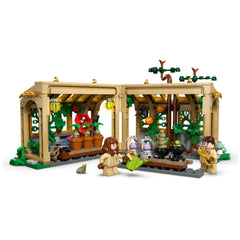LEGO Hogwarts™ Herbology Class set with a detailed greenhouse, featuring two minifigures, potted plants, and magical elements.