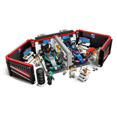 LEGO® City F1® Garage featuring two F1® race cars, a detailed workshop, and several mini-figures engaged in mechanics.