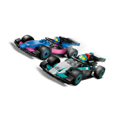 Two colorful LEGO® F1® race cars in motion, one blue and pink representing Alpine, the other black and teal for Mercedes-AMG, each with a driver in colorful helmets.