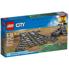 LEGO City Switch Tracks set 60238, featuring curved and switch tracks, displayed on a colorful box. Ideal for ages 5-12.