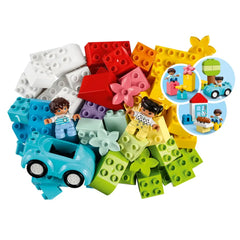Colorful LEGO® DUPLO® bricks in various shapes, with two figures and a blue car among the pieces, creating an imaginative play scene.