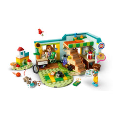 LEGO® Friends Autumn's Room set showcasing a cozy room with two mini-dolls, a ferret, and a bird, surrounded by colorful play accessories.