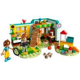 Two mini-dolls, Autumn and Leo, play in a colorful buildable room with a staircase, sunny decorations, and a ferret.
