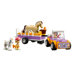 LEGO Friends Horse and Pony Trailer set featuring a purple trailer with a buildable horse, pony, and two mini-dolls, all set on a white background.
