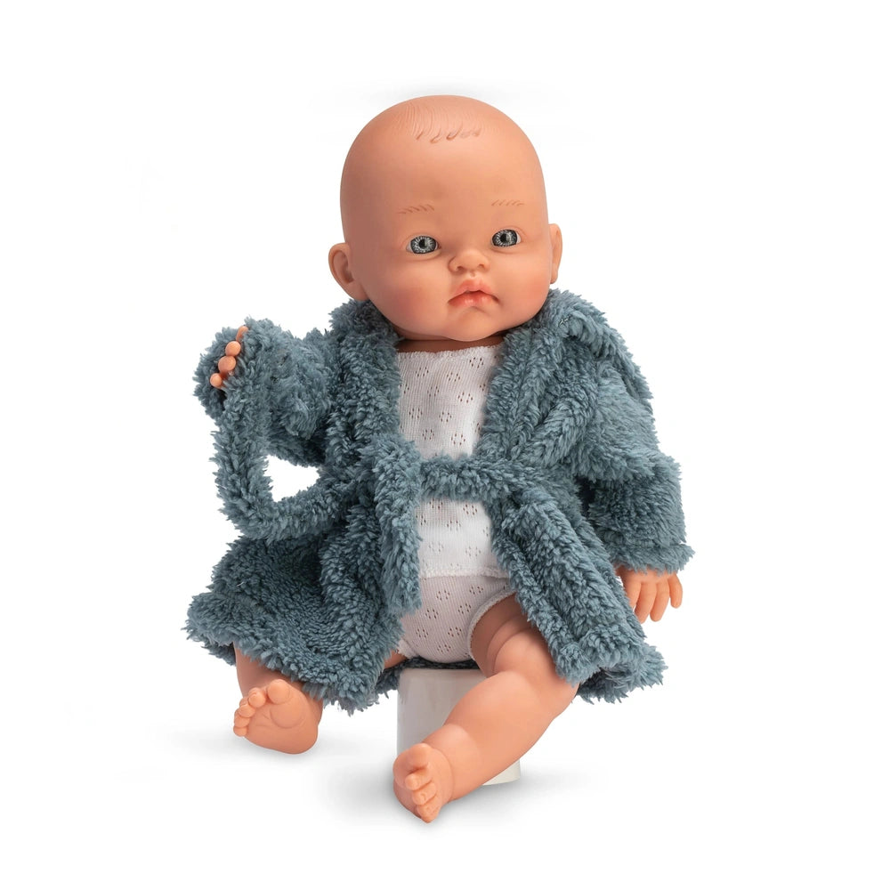 Bald doll, 36 cm, in a fluffy blue bathrobe, sitting with light-colored eyes and neutral expression.