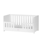 White wooden cradle with vertical slats, designed for ASI Dolls, featuring a soft padded mattress.