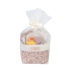 Quilted floral basket with a rubber duck and accessories, wrapped in sheer fabric, tied with a satin ribbon.