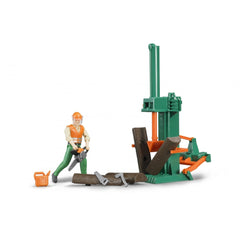 Toy figure in orange vest and helmet holding a chainsaw beside a green log splitter, logs, and tools on white background.