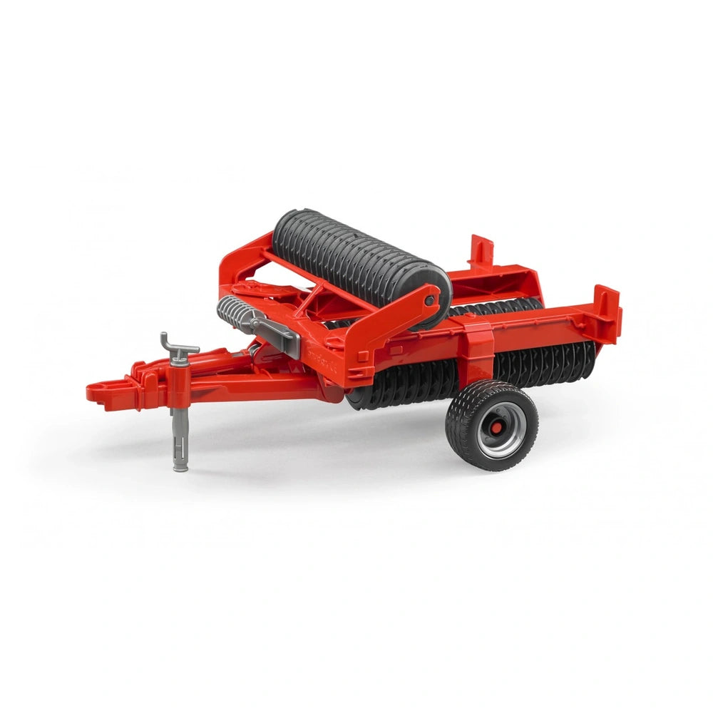 Red Bruder Cambridge Roller toy with black rollers and realistic farm design, featuring sturdy wheels and pulling hitch.