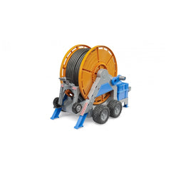 Bruder Irrigation Trailer toy with orange hose reel, blue supports, and rubber tires on a white background.