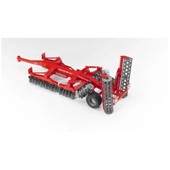 Red Bruder Kuhn Discover XL Disc Harrow toy with rotating discs and rollers on a white background.
