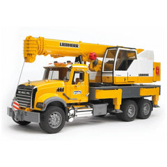 Yellow and gray Bruder Mack Granite Liebherr crane truck toy with extendable boom and detailed cabin design.