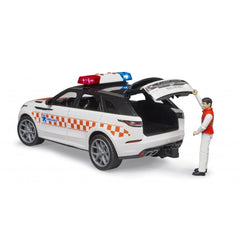 Emergency doctor's white Range Rover Velar toy with red and blue lights, rear open, driver figurine beside.