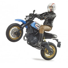 Bruder Scrambler Ducati Desert Sled toy with rider performing a wheelie, showcasing blue and gold detailing.