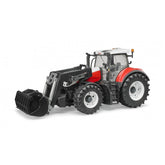 Red and black toy tractor with front loader, detailed cabin, large tires, scale 1:16, Bruder Steyr 6300 Terrus CVT model.