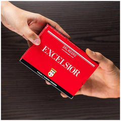 Dal Negro Excelsior Rummy Cards blue-red deck in red packaging held by a human hand, featuring logo and prominent text.
