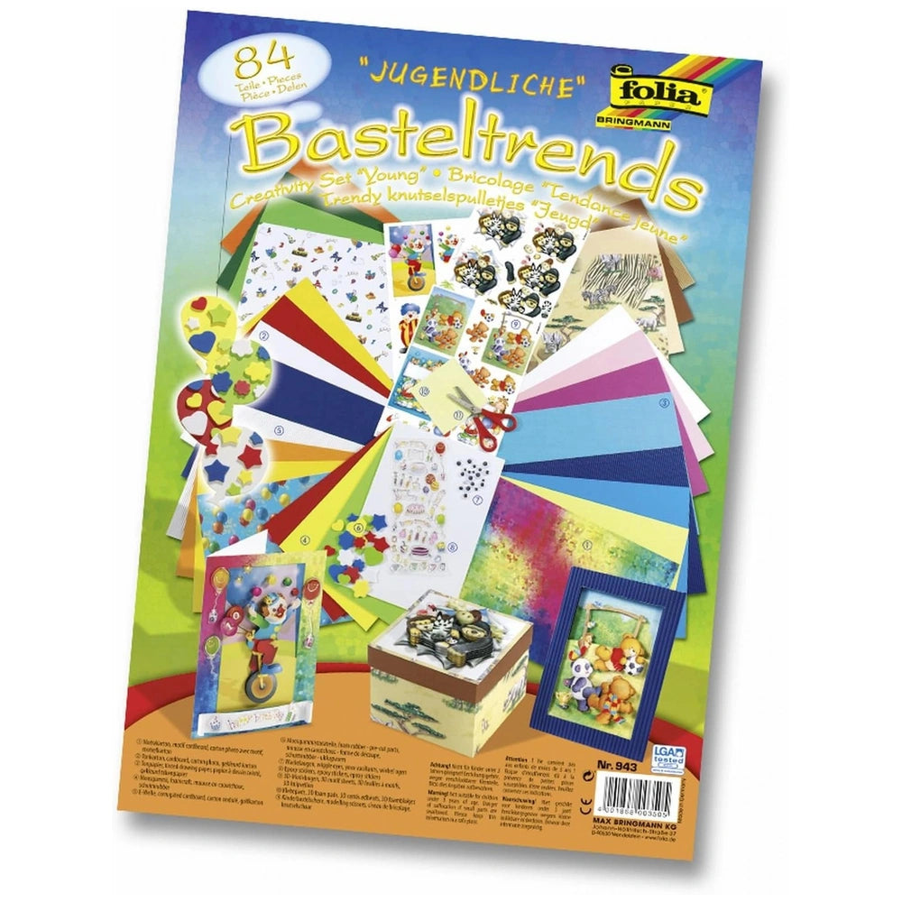 Folia Creative Bricolage Set with 84 pieces including colorful boxes, paper, fabric, scissors, ribbons, and stickers.