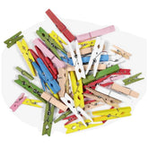 Folia wooden clips in red, yellow, green, pink, blue, and white, arranged centrally for arts and crafts projects.