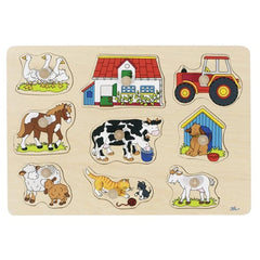 GOKI Farm I Lift-Out Puzzle packaging features nine cartoon-style animals in a grid on a matte, wood-textured background.