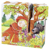 Gollness Fairy Tale Cube Puzzle packaging features a girl in a red dress with a wolf and flowers, displayed in a matte cardbo
