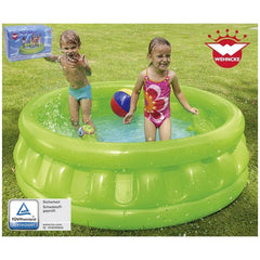 Happy People inflatable pool with two children in swimsuits playing with a red ball on green grass, featuring safety certific