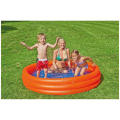 Happy People inflatable pool with orange ring and blue water, featuring a boy, woman, and girl on grass.