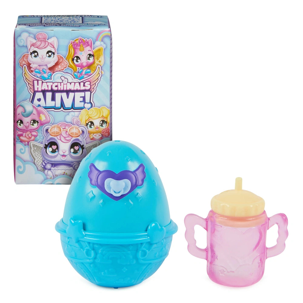 Hatchimals Alive toy egg in blue with purple accents beside a pink egg holder with a yellow lid on a white background.