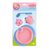 Heless Eat And Drink Set features pink teapot, plate, and blue spoon, showcased in glossy retail packaging with floral design