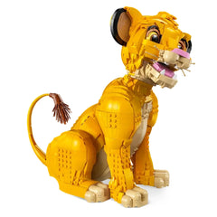 Construction set featuring a detailed LEGO model of Young Simba from The Lion King, showcasing vibrant yellow fur, a movable head, and expressive features, positioned in a seated pose with a bushy tail.