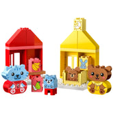 Colorful LEGO® DUPLO® construction set showcasing two cozy houses, featuring animal figures of a kitten and a bear in playful scenarios.