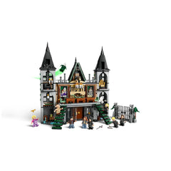 LEGO® Harry Potter™ Malfoy Manor set with detailed castle facade, green spiral stairs, and figures of Draco Malfoy, Harry Potter, and others.