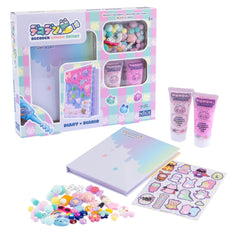 Momomi Decoden Kawaii Arts & Crafts Kit in a pink and blue matte cardboard box with a transparent window and assorted sticker
