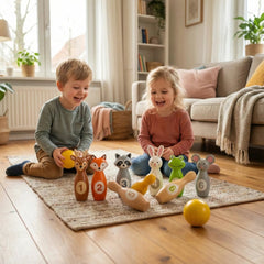 New Classic Toys bowling set with colorful plush animals, two children playing on wooden flooring with a neutral carpet.